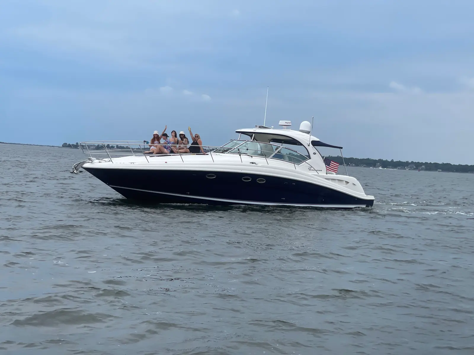 Friends celebrating together aboard a Charleston charter yacht